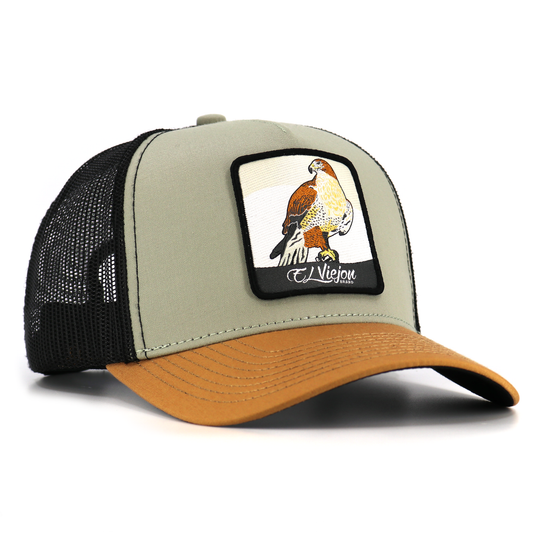 Halcon Camel/Tope/Black AVC hat with a hawk patch, pre-curved visor, and black mesh back.