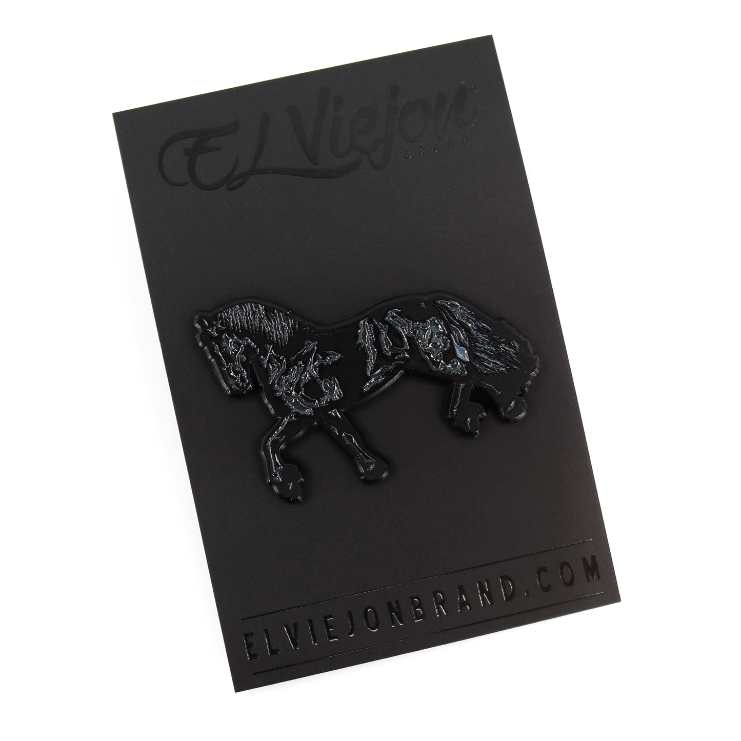 Black Frison horse enamel pin with rubber clutch on a black branded card.
