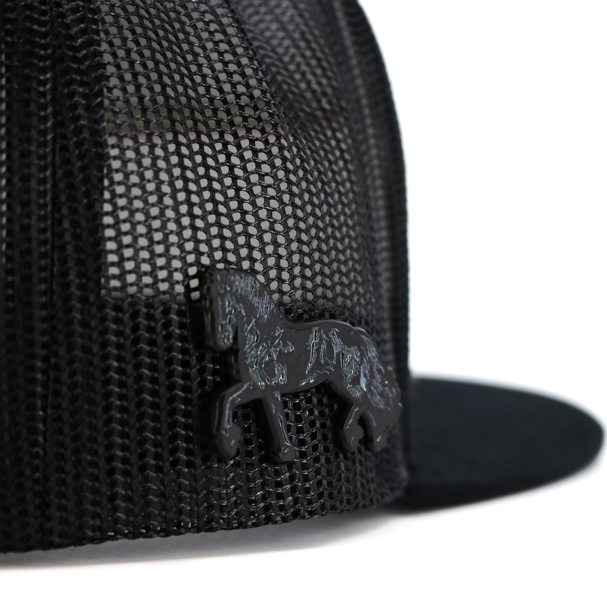 Black Frison horse pin with rubber clutch, attached to a black mesh cap.