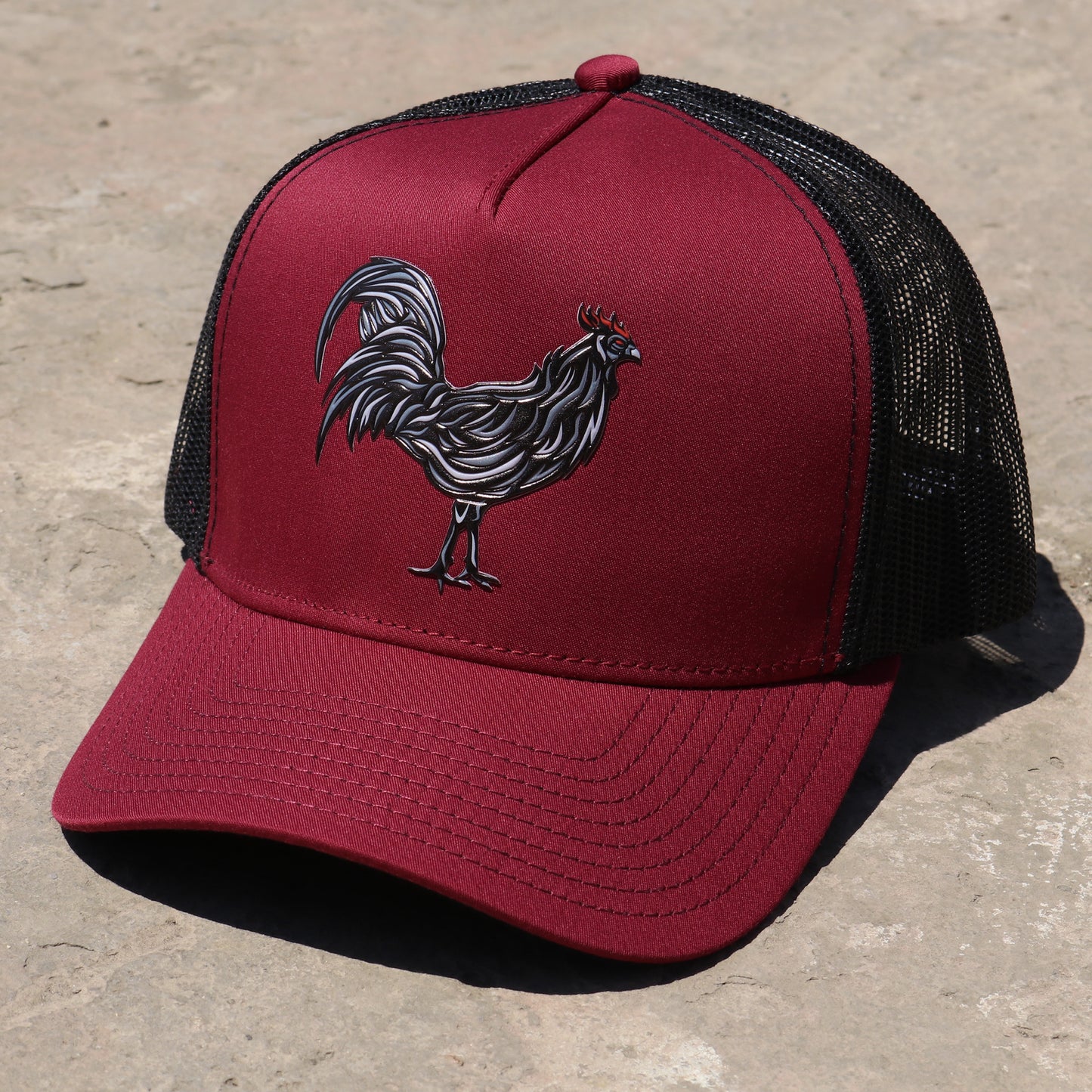 Gallo Negro maroon/black AVC hat with a stylized rooster embroidery and black mesh back.