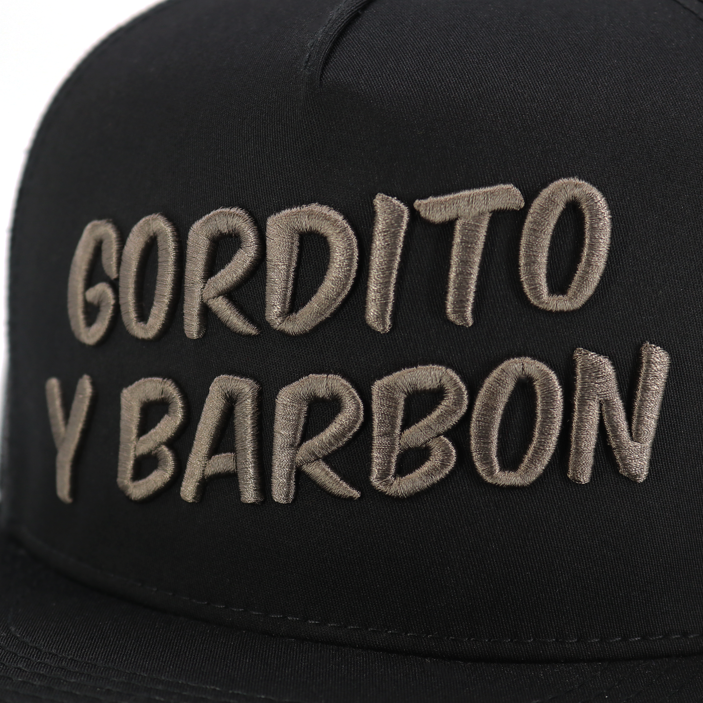 Black Gordito Y Barbon flat visor hat with charcoal embroidered logo, high profile, 5-panel design.