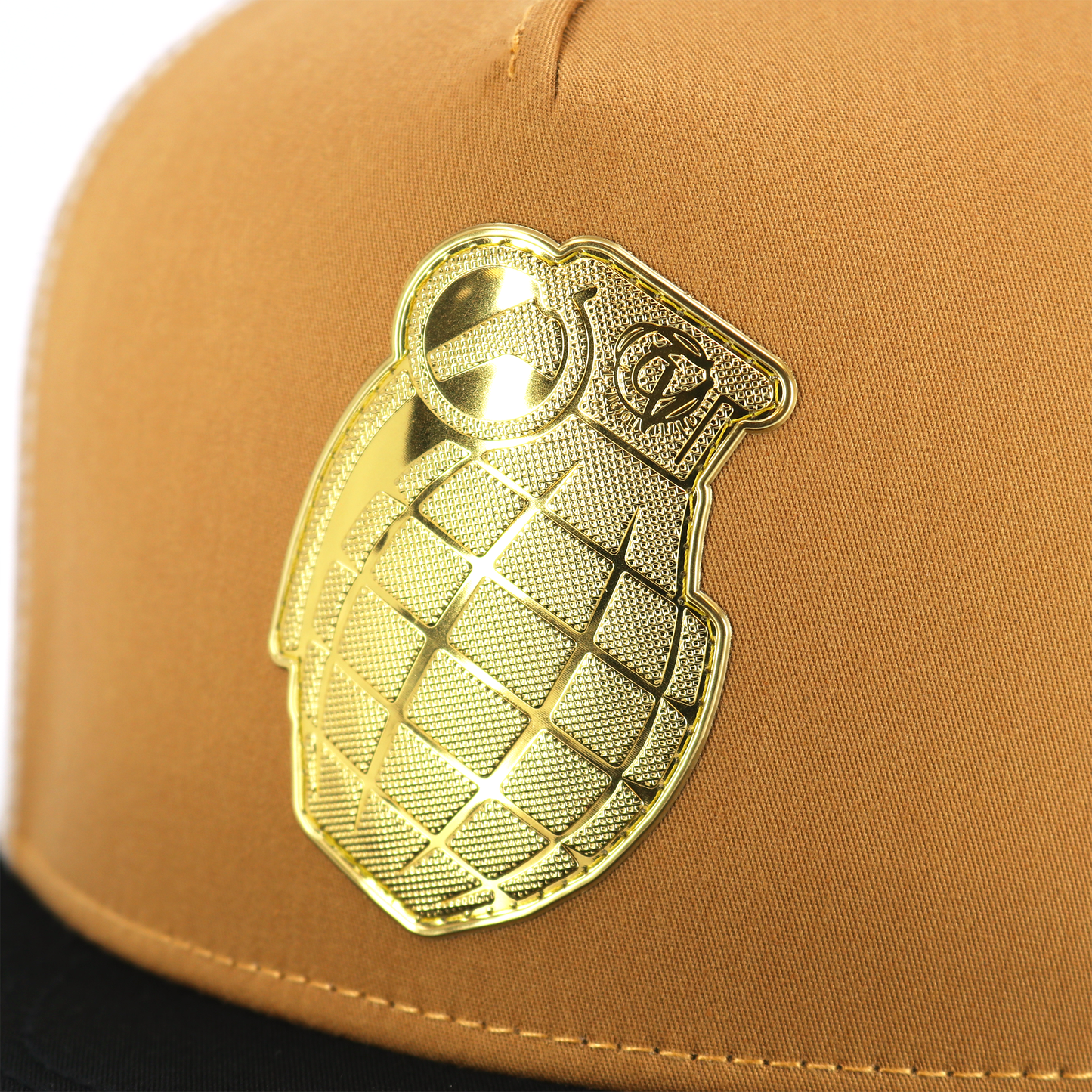 Granada Black/Caramel/White flat visor hat with a gold grenade emblem.