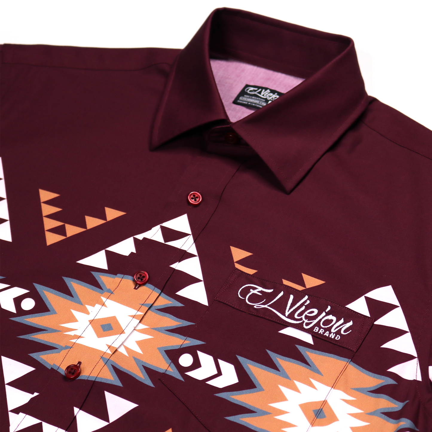 Hidalgo Maroon dress shirt, 100% cotton, with colorful geometric Aztec-inspired patterns and "El Viejon Brand" logo.