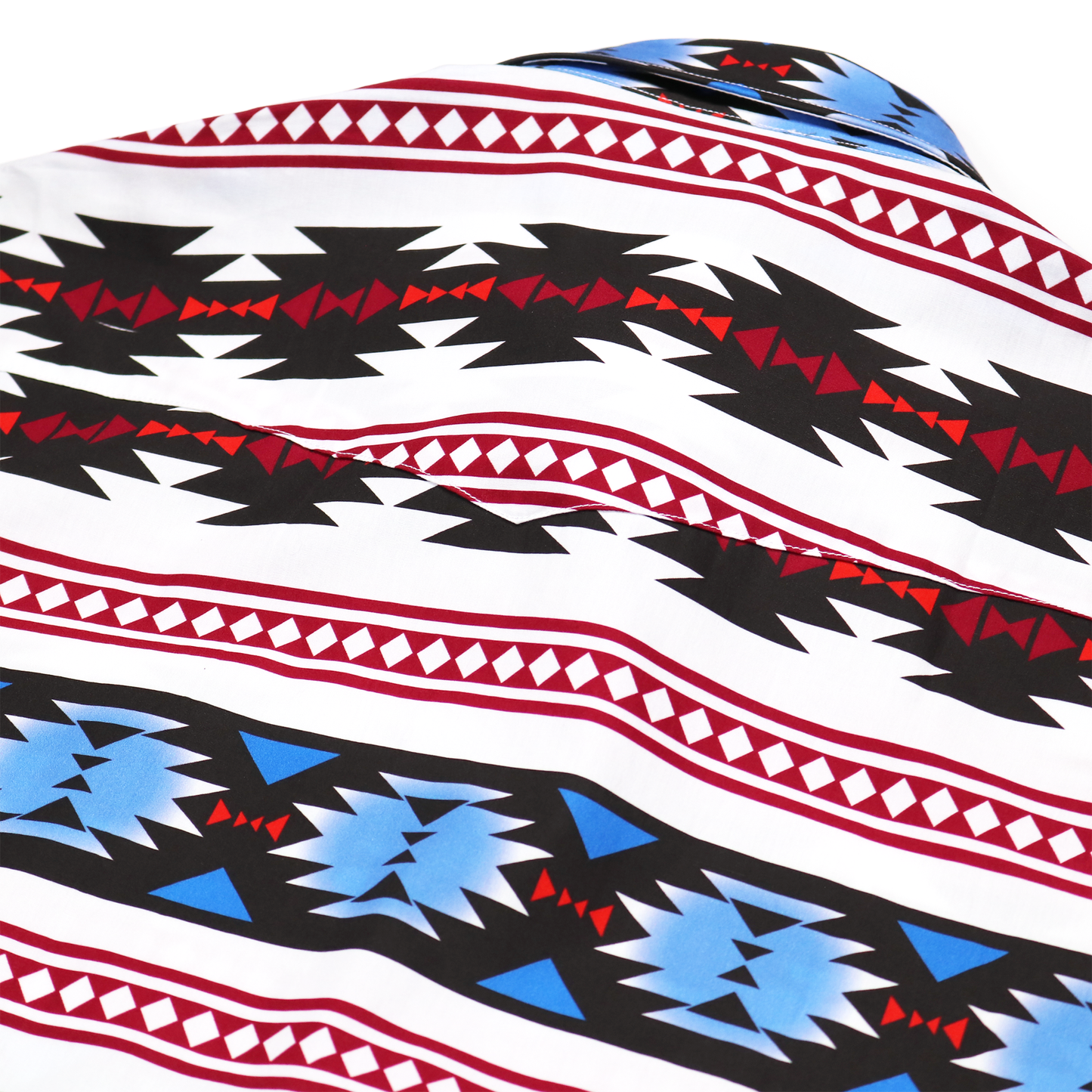 Lakota White dress shirt with red, black, and blue geometric patterns, straight collar, and long sleeves.