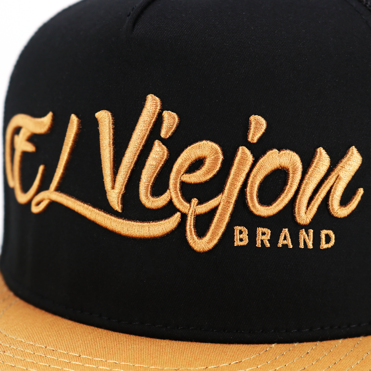 La Original Camel/Black flat visor hat with gold "El Viejon Brand" embroidery.