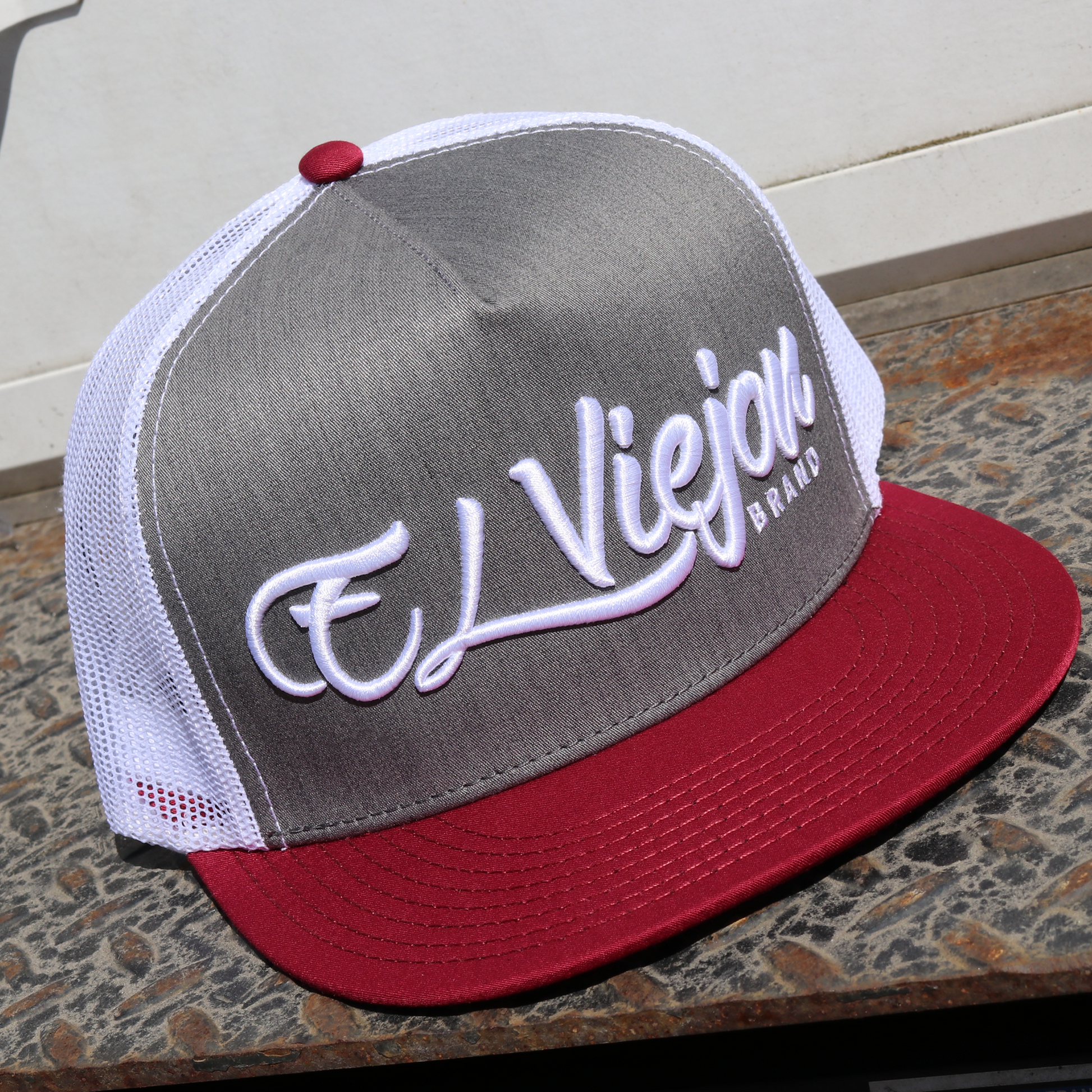 La Original Maroon/Heather/White flat visor hat with "El Viejon Brand" embroidered.