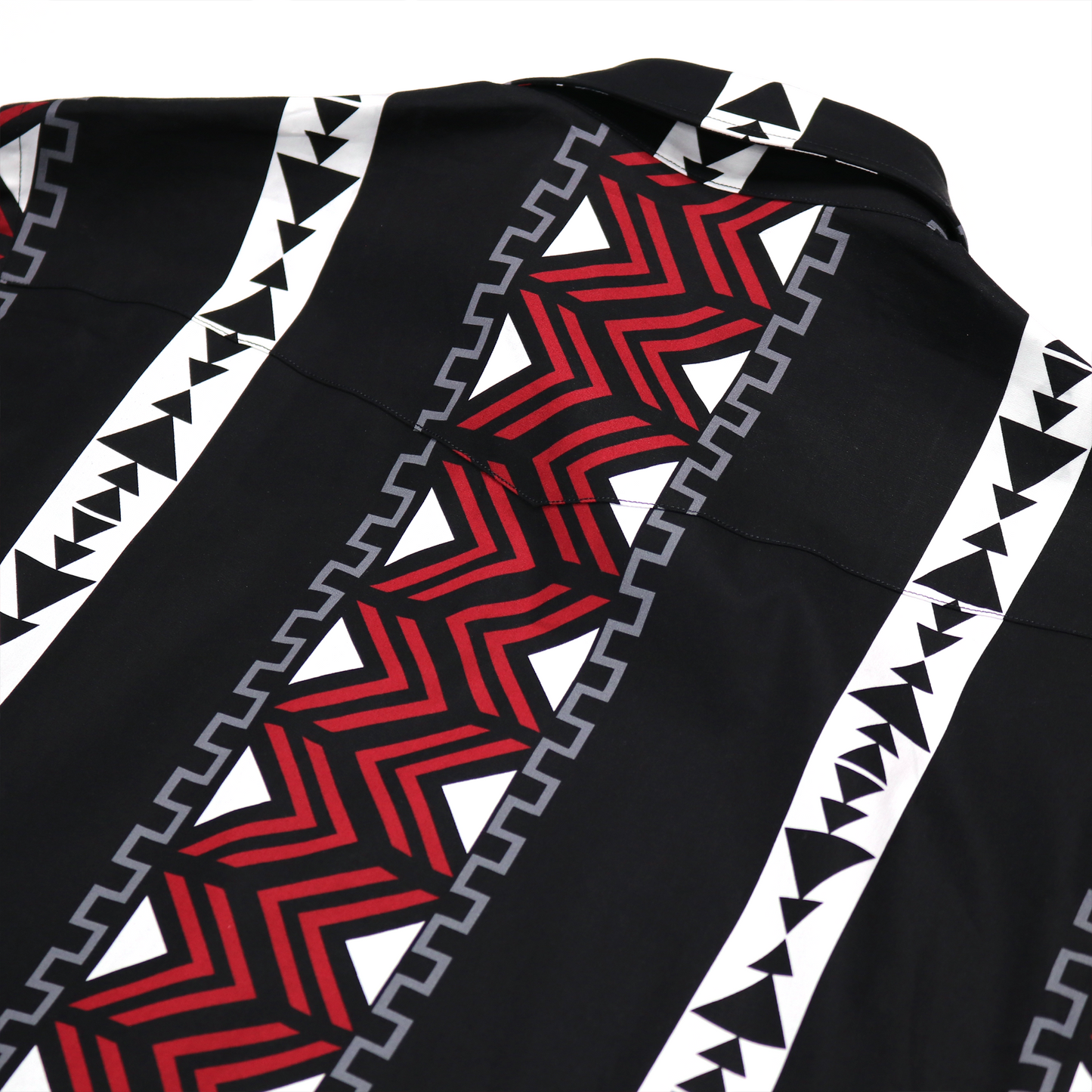 Black cotton dress shirt with red, white, and gray geometric tribal pattern.