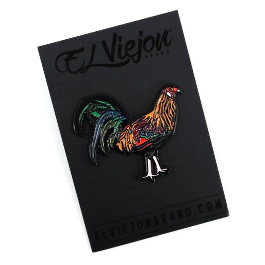 Gallo Colorado enamel pin with vibrant orange, red, green, and blue feathers on a black backing card.