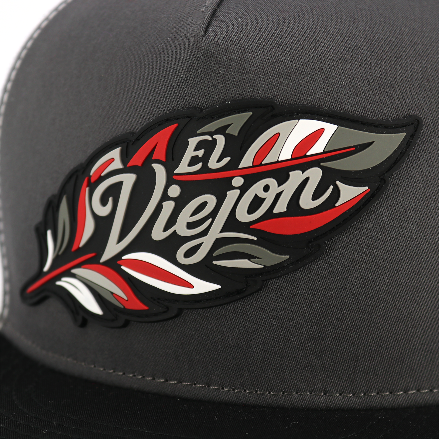 Poblador Black/Charcoal/White flat visor hat with "El Viejon" feather logo.
