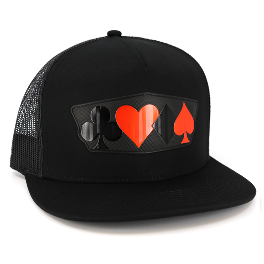 Black flat visor trucker hat with black mesh and a red/black poker suit emblem.