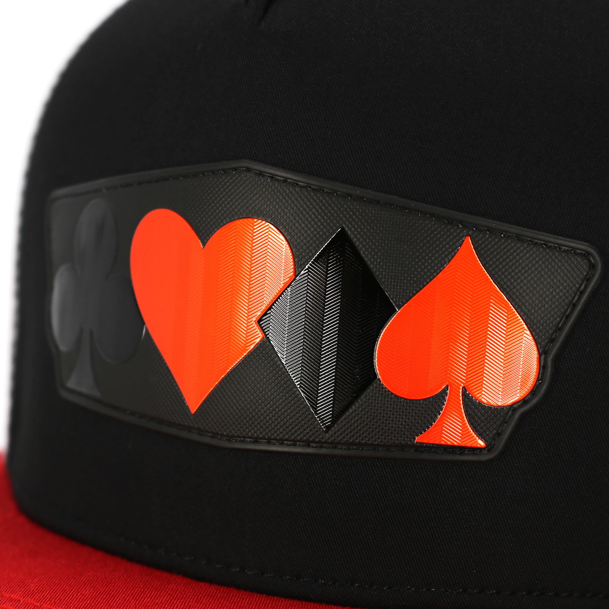 Black flat visor hat with red, black, and white poker suit symbols on a textured patch.