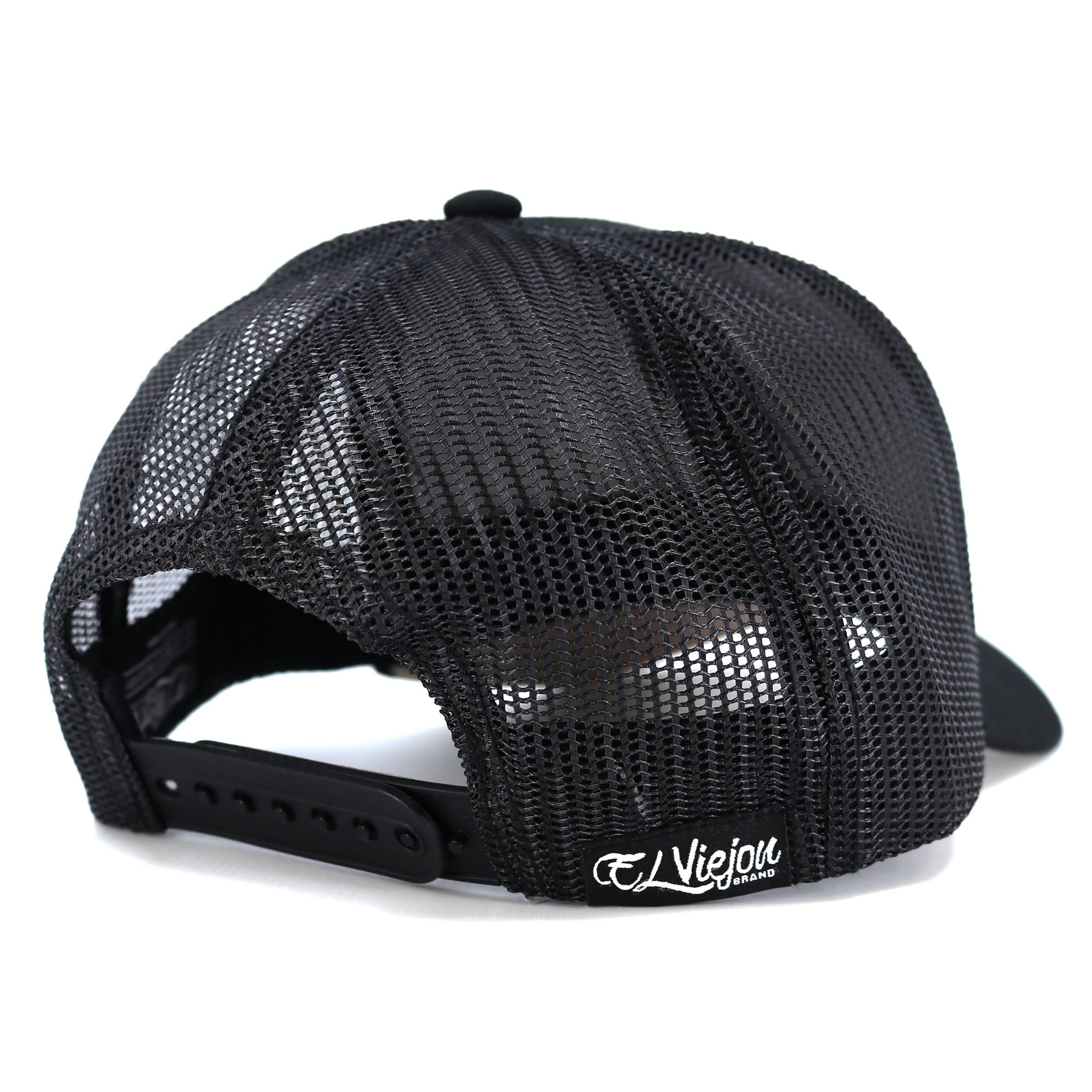 Pollito Black kids' trucker hat with mesh back, curved visor, and adjustable snapback.