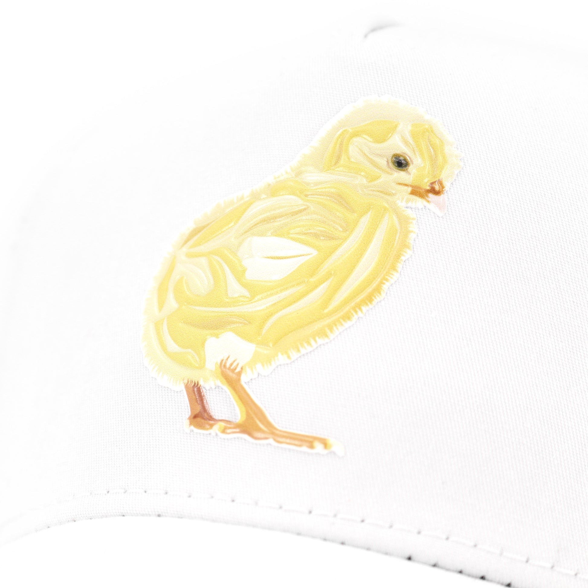 White kids' hat with a yellow baby chick graphic, high profile, curved visor.