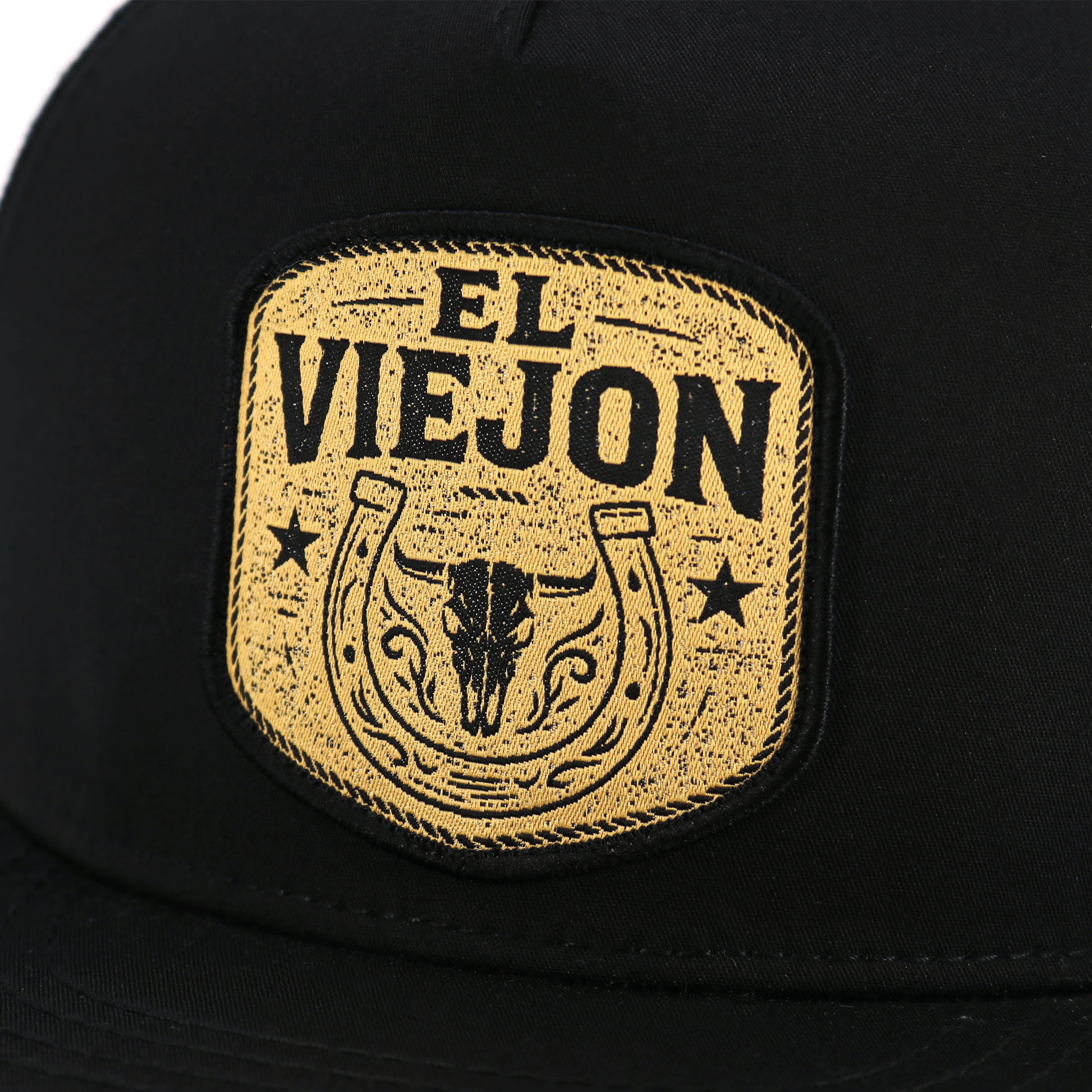 Rancho Viejo Black flat visor hat with gold "El Viejon" patch, bull skull, and horseshoe design.