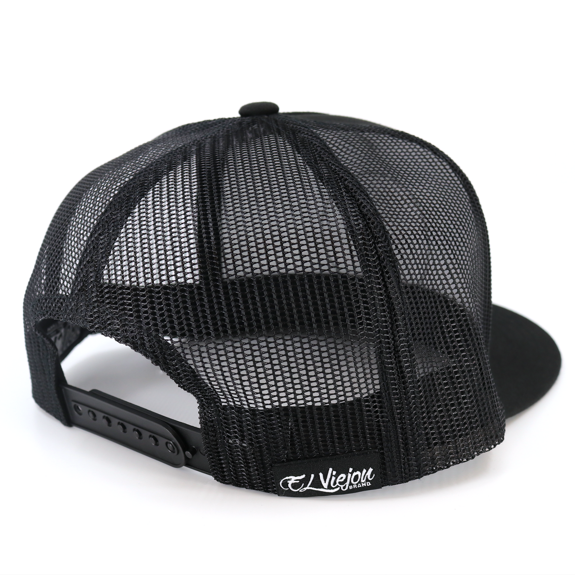 Black San Judas flat visor trucker hat with black mesh back and adjustable snapback.