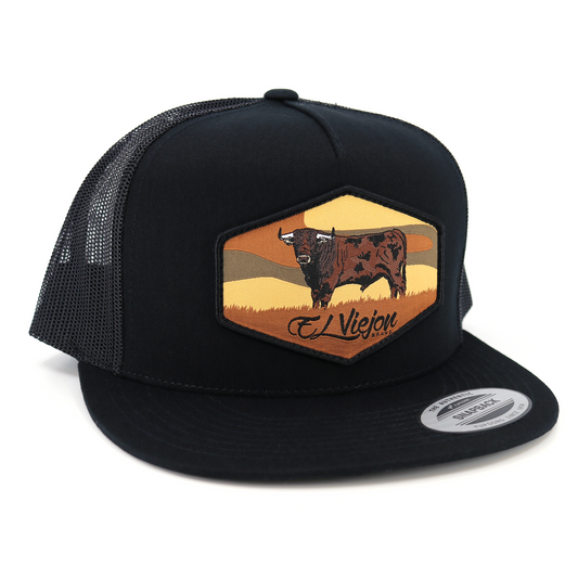 Semental Black Yupoong trucker hat with flat visor and bull patch.