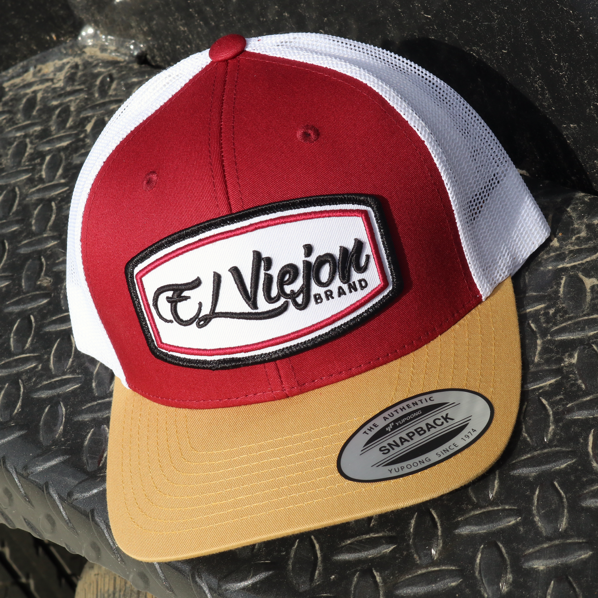 Ultra Tan/Maroon/White Yupoong Classic trucker hat with "El Viejon Brand" patch.
