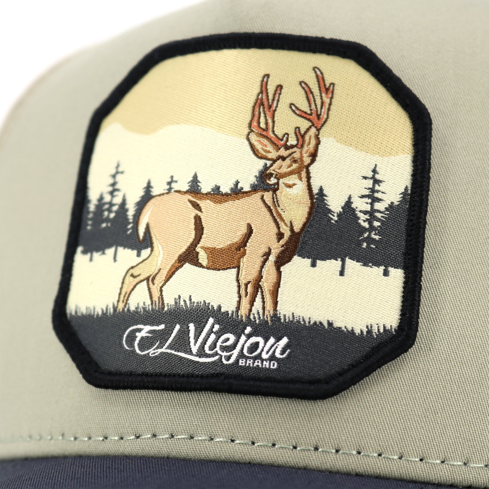 Venado Grey/Tope/Khaki AVC hat with an embroidered deer patch, forest, and "El Viejou Brand" text.