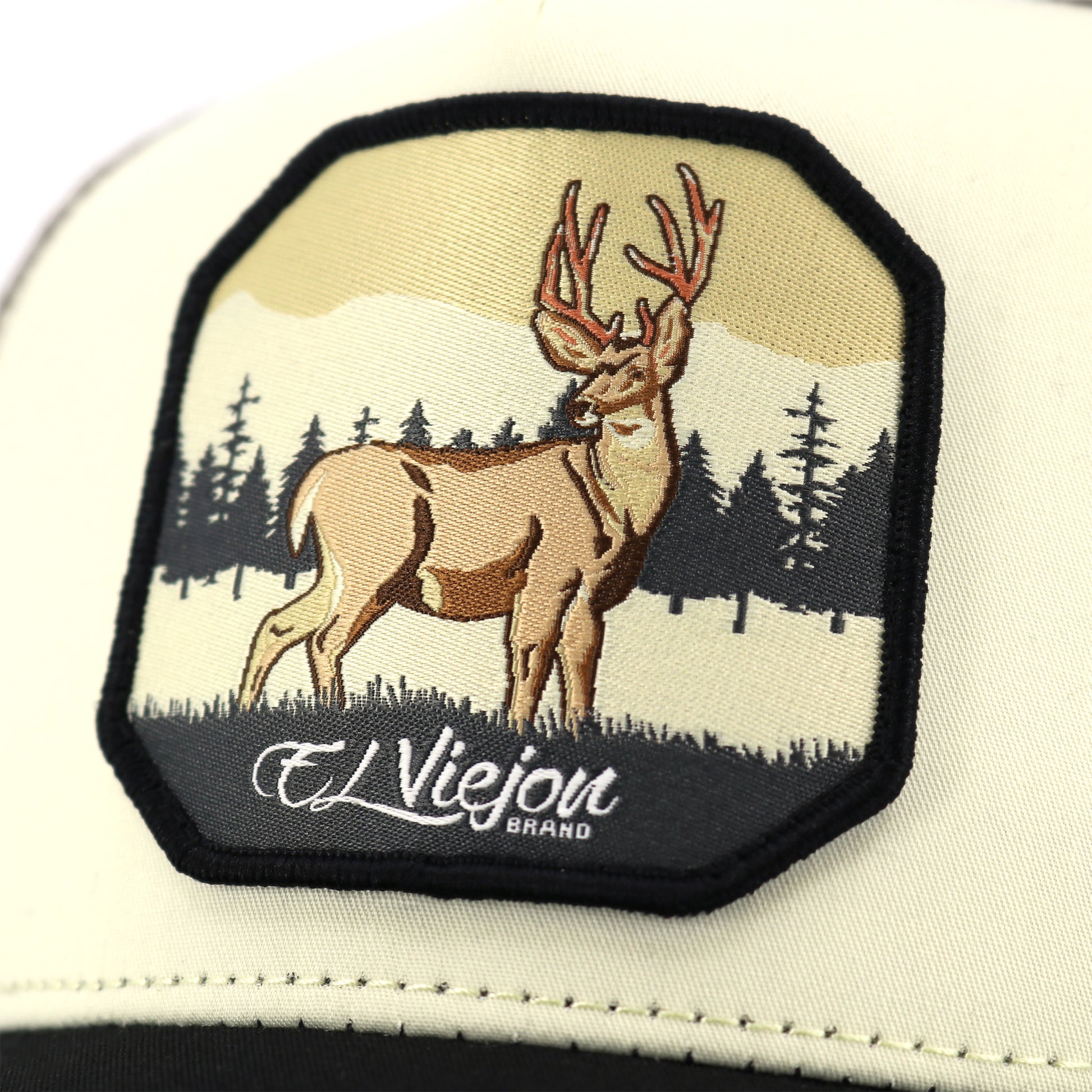 Venado AVC hat with embroidered deer patch, forest scene, and "El Viejon Brand" text.