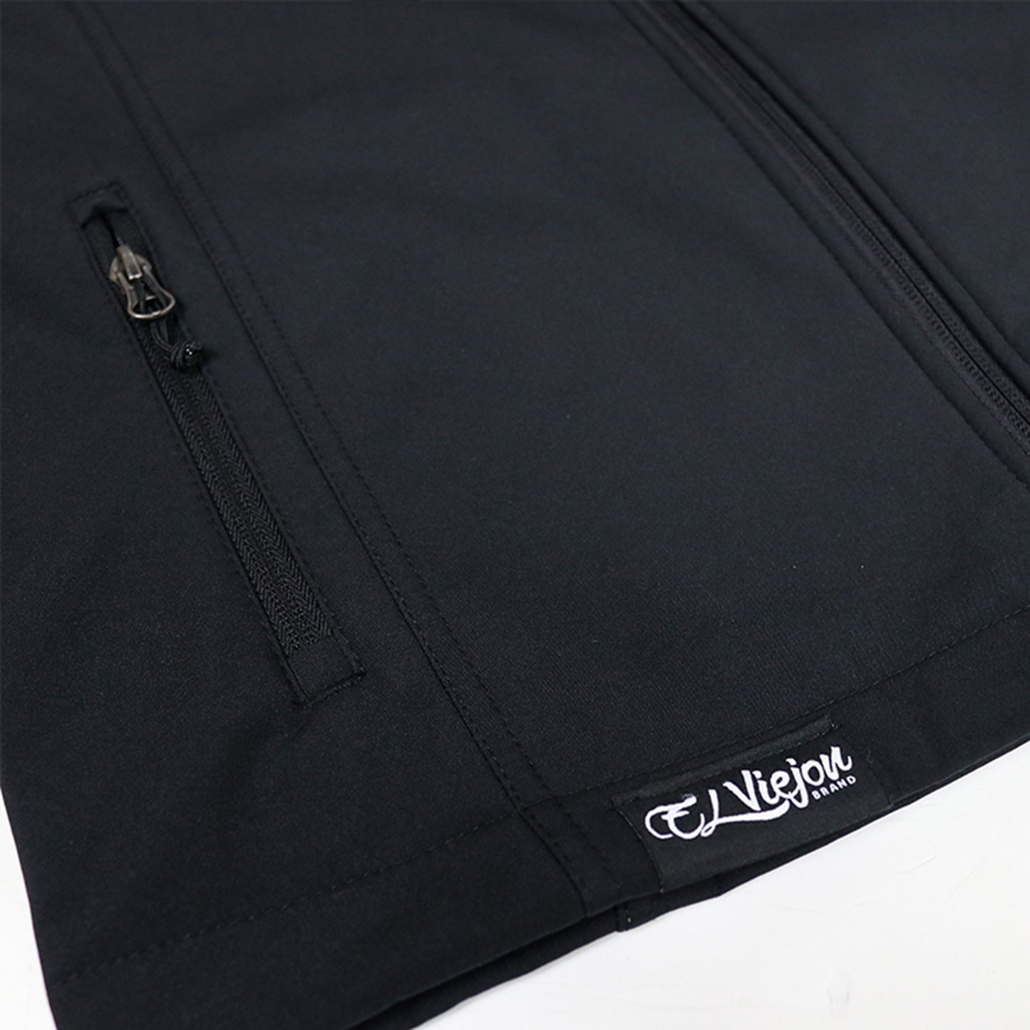El Viejon Brand black polyester vest, front view, with zippered pockets and a white logo patch.