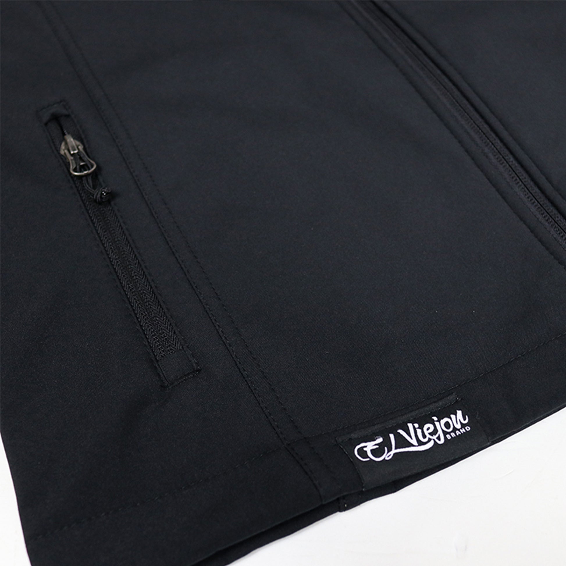 El Viejon Brand black polyester vest, front view, with zippered pockets and a white logo patch.