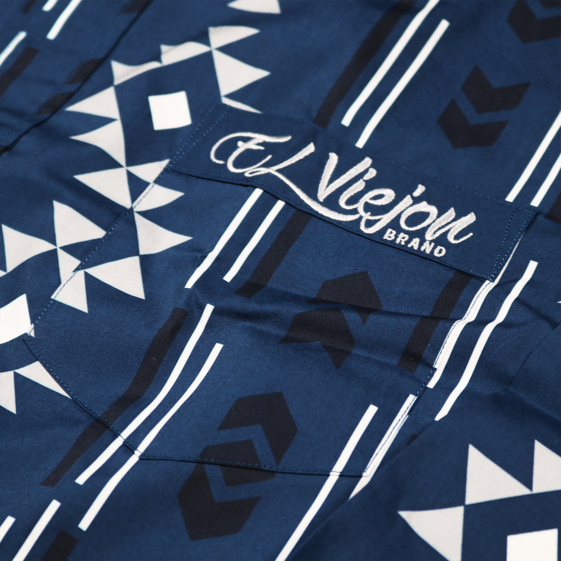 Dress shirt Sonora Navy, 100% cotton, with white and black geometric pattern and El Viejon Brand embroidered logo on front pocket.