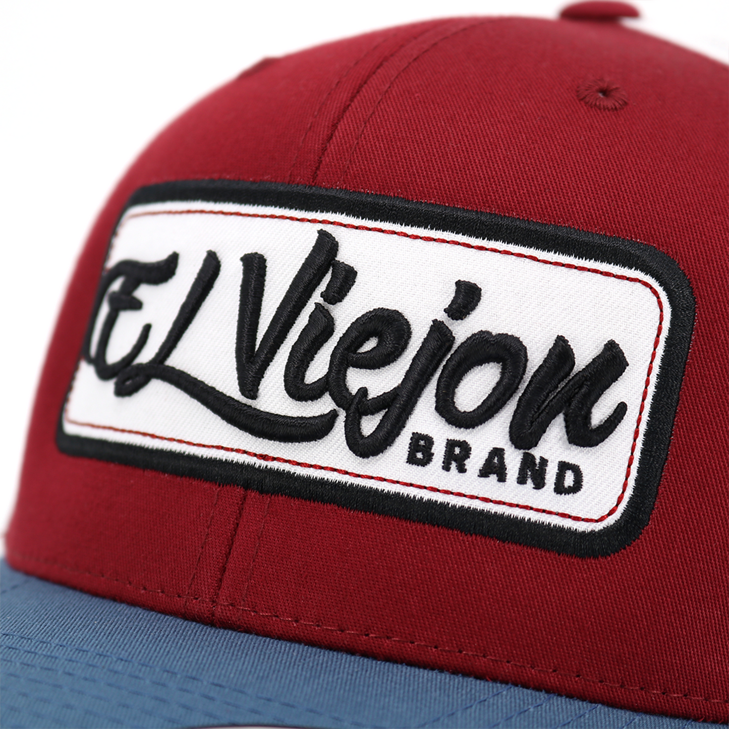 EVPatch Indigo/Maroon/White Yupoong Classic trucker hat with "El Viejon Brand" embroidered patch.