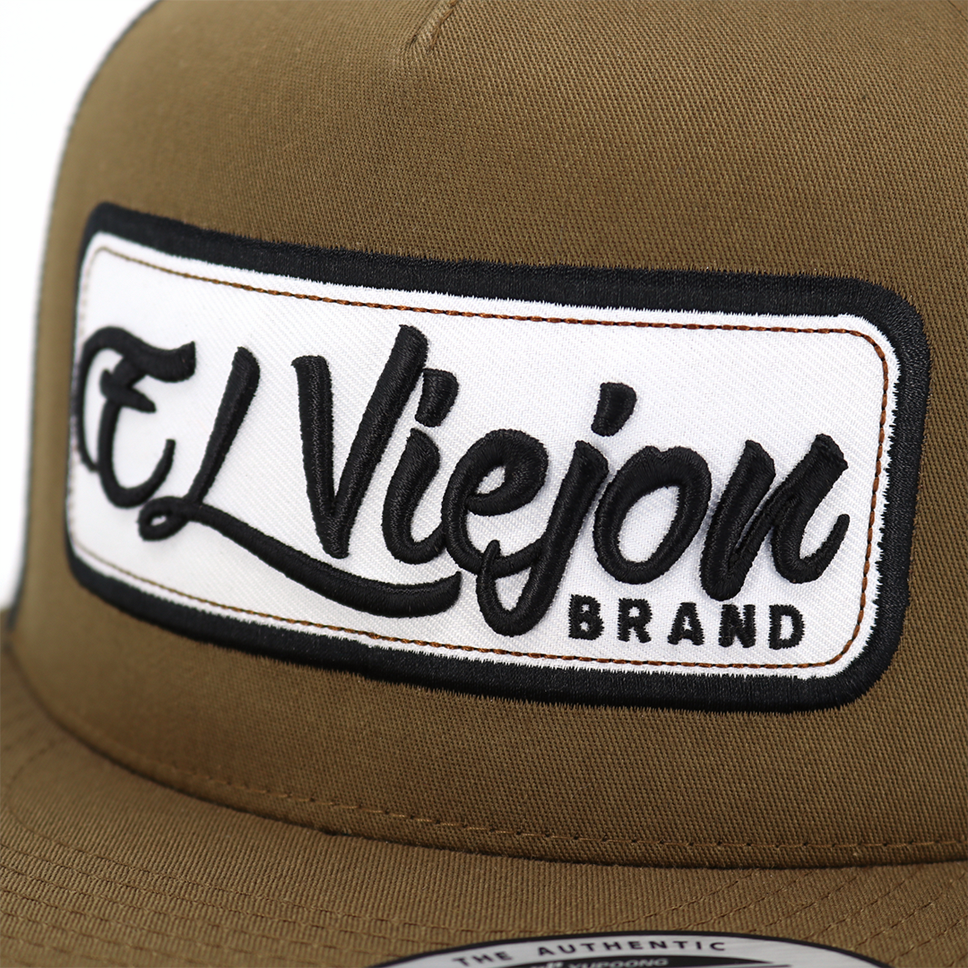 Coyote/black EVPatch flat visor trucker hat with "El Viejon Brand" embroidered patch.