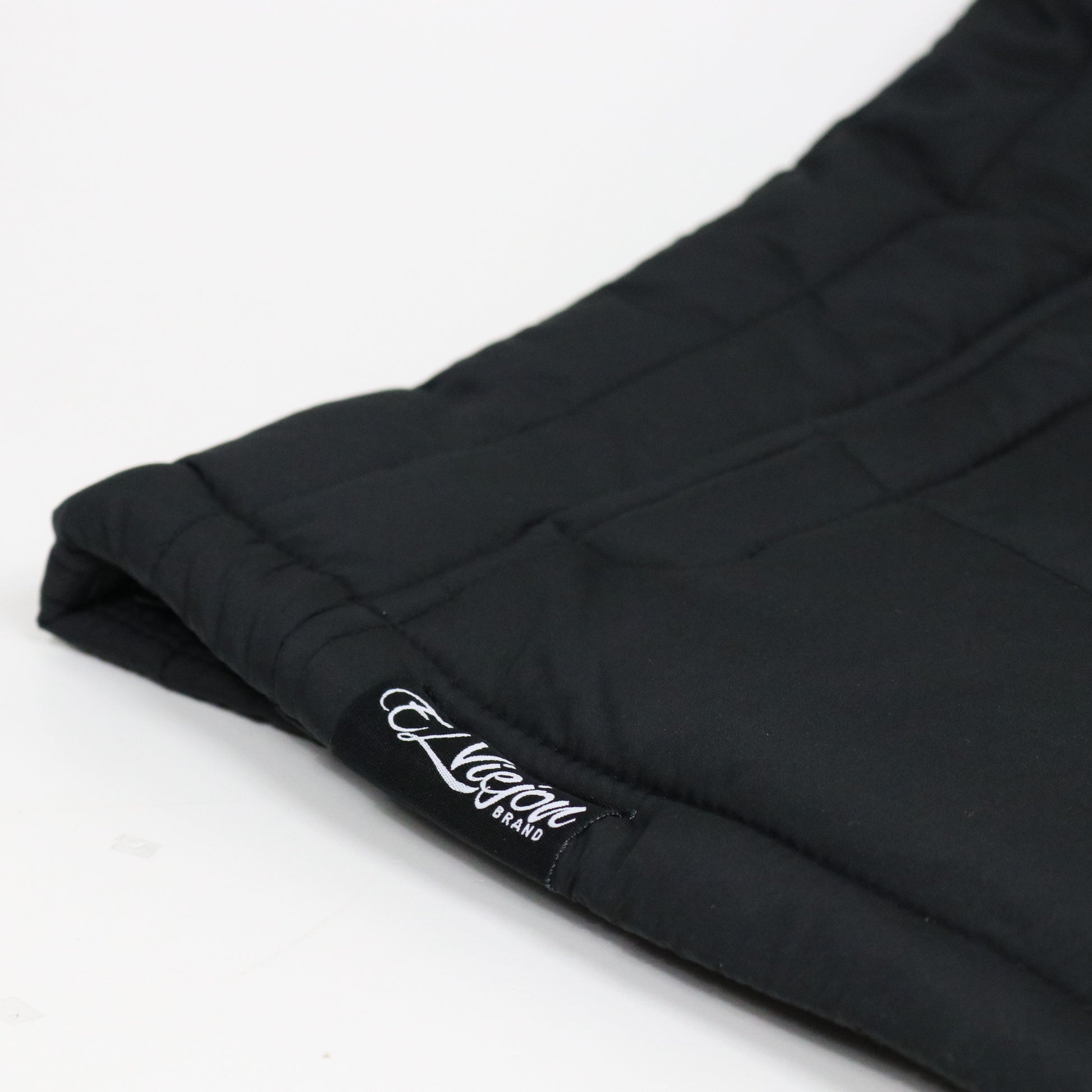 Black El Viejon Brand Vest with charcoal logo, quilted polyester, front view.