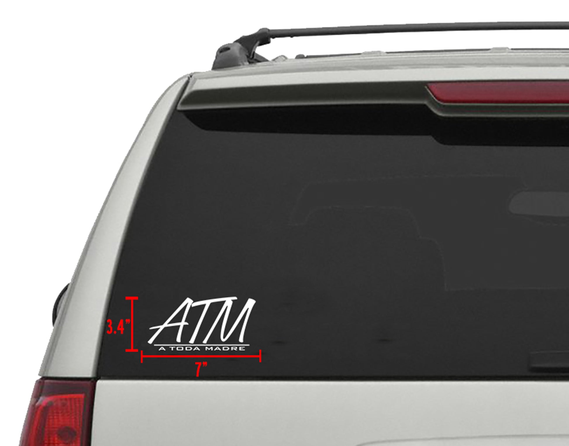 White "ATM A TODA MADRE" die-cut vinyl decal, 7"x3.4", applied to a vehicle's rear window.