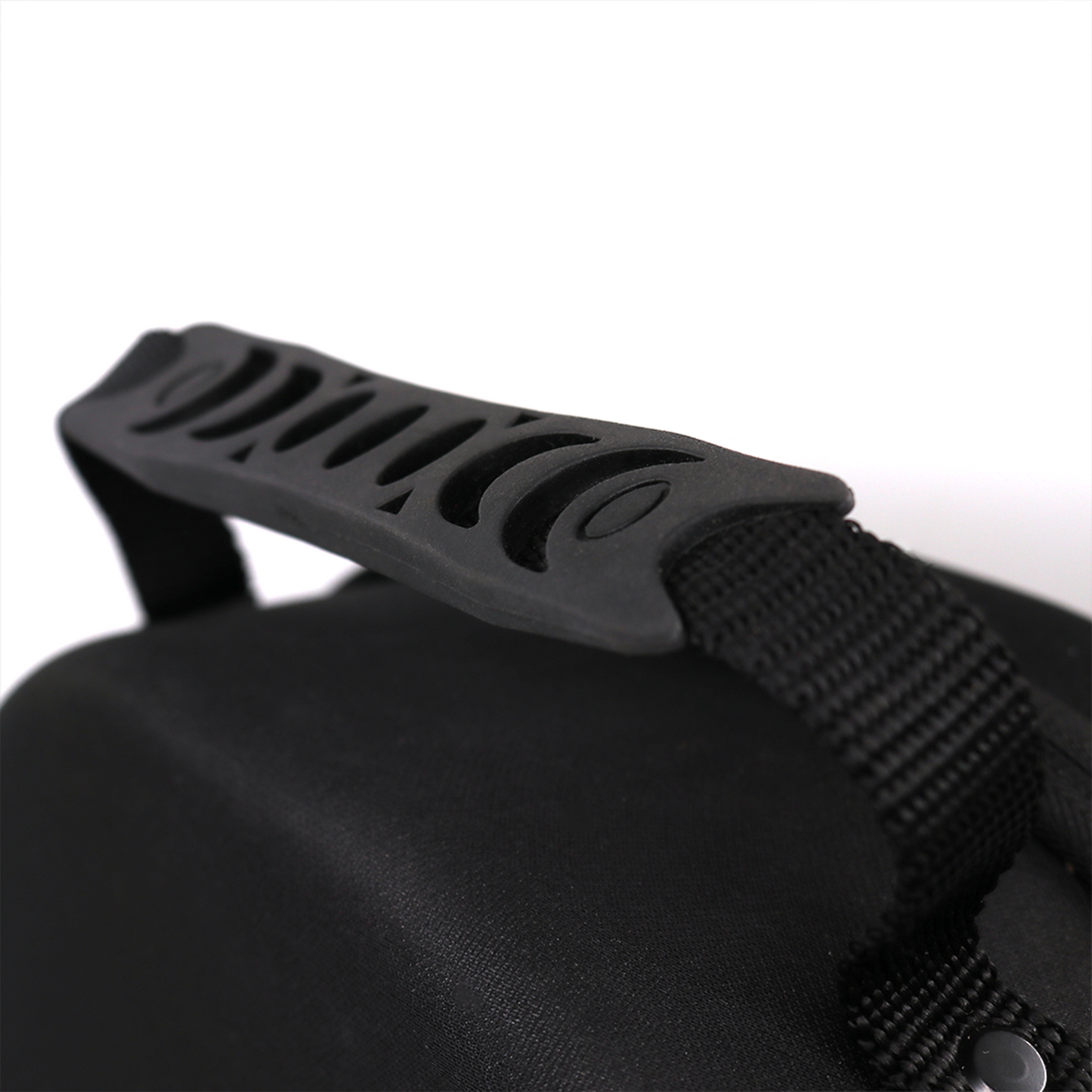 Close-up of the black, rigid EVA El Viejon hat carrier handle with textured grip and webbing strap.