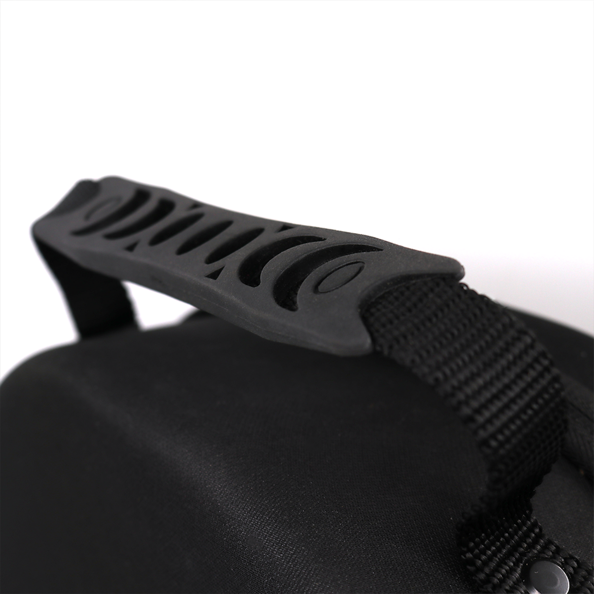 Close-up of the black, rigid EVA El Viejon hat carrier handle with textured grip and webbing strap.