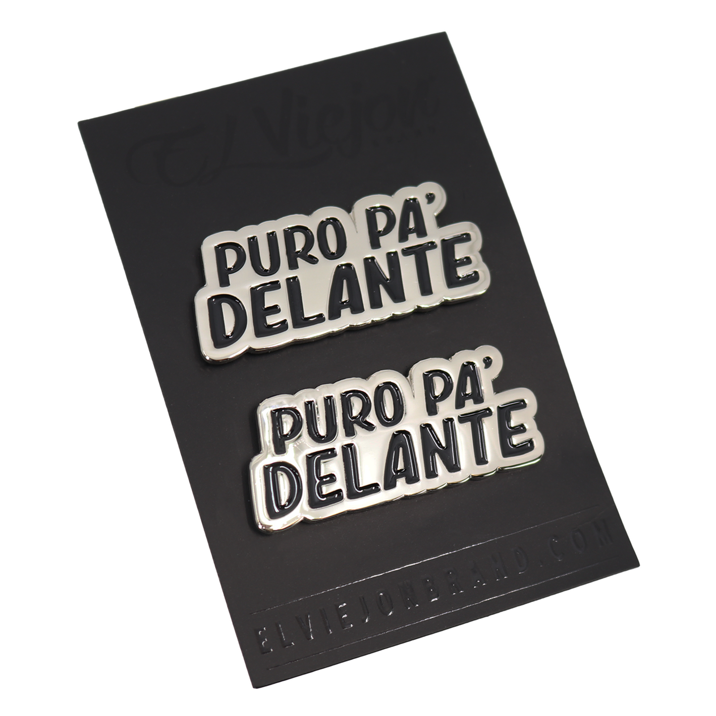 Two silver and black enamel pins spelling "PURO PA' DELANTE" on a black card.