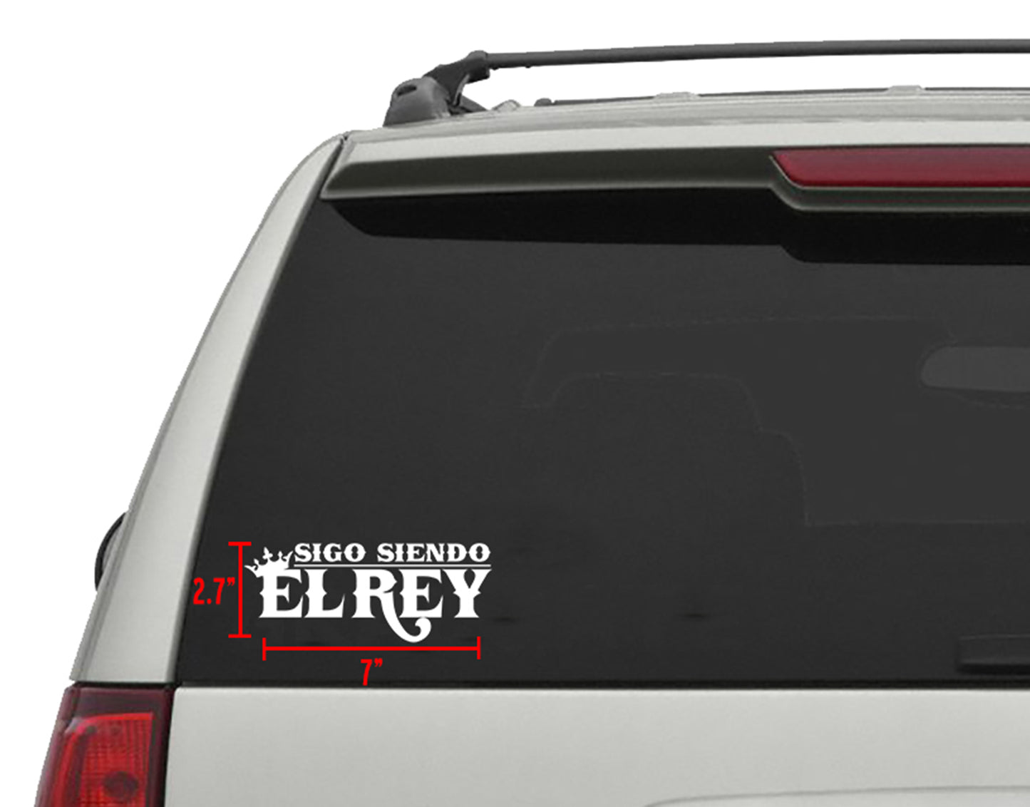 White "Sigo Siendo El Rey" die-cut vinyl sticker, 7"x 2.7", on a vehicle's rear window.